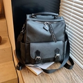 Zaino grigio scuro versatile di grande capacità con fibbie metalliche e spallacci ampi - Nero