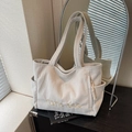 Large cream corduroy tote bag with yellow embroidery and side pockets for casual daily commute - Off-white