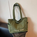 Green corduroy tote bag with TOTE BAG embroidery and practical side pocket detail - Green