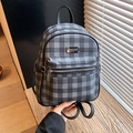 Classic black and grey checkered backpack with front zipper pocket and metal plate - Black