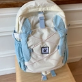 Sac à dos minimaliste en nylon léger beige et bleu avec broderie de pingouin - Grand / Bleu