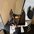 Brown quilted crossbody bag with gold chain strap and stylish suede finish - Brown