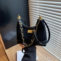 Black quilted suede underarm bag with gold chain strap and elegant metal twist lock - Black