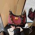 Quilted burgundy suede hobo bag with black leather trim and gold chain strap - Red