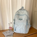 Light blue student backpack with gray star print and multiple storage pockets - Blue
