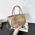 Champagne velvet tote bag with mini charm and adjustable strap for women in hand - Khaki with Pendant