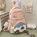 Pink student backpack with house-shaped front pocket and white plush puppy charm - Pink with Pendant