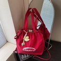 Red nylon drawstring tote bag with white Banatu logo and plush moon pendant - Red with Pendant