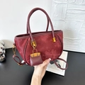 Sophisticated burgundy suede shoulder bucket bag with twin handles and small charm - Red with Pendant