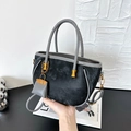 Elegant black suede tote bag with grey leather straps and a gold charm accessory - Black with Pendant