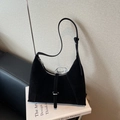 Minimalist black faux suede hobo bag featuring silver ring buckle and adjustable strap - Black