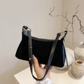 Minimalist black faux suede shoulder bag with gold metal rings and sleek top zipper - Black