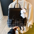 Fashionable black and grey checkered backpack with plush dog charm and leather trim - Black