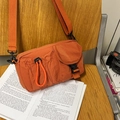 Bright orange pleated nylon crossbody chest bag with front buckle pocket for outdoor leisure - Caramel color