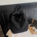 Minimalist black suede tote bag with slim leather straps and silver buckle detail - Black