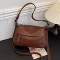 Vintage brown leather crossbody bag with adjustable canvas strap and tassel detail - Brown