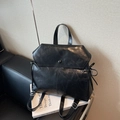 British vintage black oil-wax leather backpack with drawstring bow and flap closure - Black