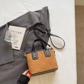Crossbody bucket bag in brown faux suede with embossed patterns and black leather trim - Brown (No Pendant)