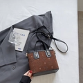 Brown suede crossbody bucket bag with star patterns and black leather trim accents - Black & Coffee (Without Charm)
