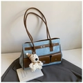 Detail of blue denim tote bag with brown PU leather pocket and plush puppy charm - With Pendant / Blue
