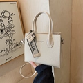Beige woven leather square crossbody bag with top handles and fashion ribbon detail - Off White