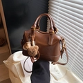 Brown vintage Boston handbag with teddy bear charm and adjustable shoulder strap - With Charm / Brown