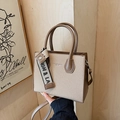 Minimalist beige woven square handbag with brown leather trim and a branded ribbon - Khaki