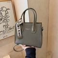 Olive green minimalist tote bag with smooth leather handles and canvas ribbon detail - Green