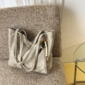 Large capacity grey tote bag in soft faux suede finish with wooden bead tassel on sofa - Off-White (With Bead Pendant)