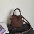 Vintage dark brown faux suede bucket bag with woven handle and adjustable strap - Brown