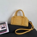 Chic warm yellow bowling bag with a soft suede texture and leather top handles - Ginger Yellow