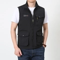 Detail of black tactical vest featuring a stand collar and four large functional pockets - M / Black