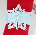 Laser-cut light blue pearl paper snowflake napkin rings for elegant holiday table decor - Pearl Pale Blue