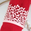 Pink laser-cut leaf pattern paper napkin ring on red napkin for wedding table decor - Pink