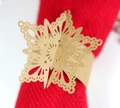 Macro detail of laser-cut snowflake napkin ring with intricate hollowed patterns - Kraft Paper
