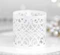 Macro detail of white laser-cut hollow candle shade with intricate vine patterns - Ivory