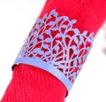 Macro shot of laser-cut purple pearl paper napkin ring with intricate leaf vein pattern - Sapphire Blue