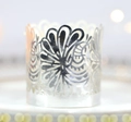 Laser-cut silver metal tea light holder featuring hollow flower and peacock patterns - Reflective Silver