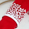 Elegant white laser-cut leaf napkin rings on a red fabric napkin for wedding banquet decor - White
