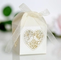 Laser-cut white wedding favor box with hollow bird and heart patterns and silk ribbon - Ivory