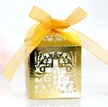 Golden hollow laser-cut wedding favor box with cross pattern and satin ribbon bow - Reflective Gold