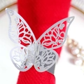 Silver butterfly napkin ring with laser-cut hollow pattern on a red fabric napkin - Reflective Silver