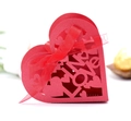 Detail of red hollowed-out Love heart candy box with laser-cut patterns and silk ribbon - Pearlescent Red