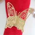 Golden laser-cut butterfly napkin ring with mesh texture on a vibrant red cloth - 22cm / Kraft Paper