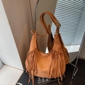 Caramel brown suede shoulder bag with long fringes and bohemian tassel details - Yellow Brown