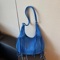 Royal blue faux suede hobo bag featuring dense long tassels and adjustable strap - Blue
