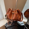 Brown pleated bucket bag with gold chain drawstring and decorative wooden beads - Brown (With Pendant)