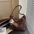 Brown glossy leather hobo bag with plush sheep charm and gold logo detail - Coffee with Pendant