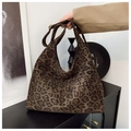 Close-up of leopard print hobo bag in soft suede-like texture for autumn fashion - Leopard Print