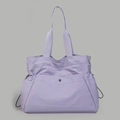 Detail of light purple water-resistant nylon tote bag with wide handles and side drawstrings - Purple